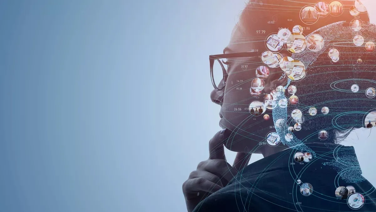 Side profile of a person with glasses touching their chin thoughtfully, overlaid with digital data points and interconnected circular images representing technology and information flow.