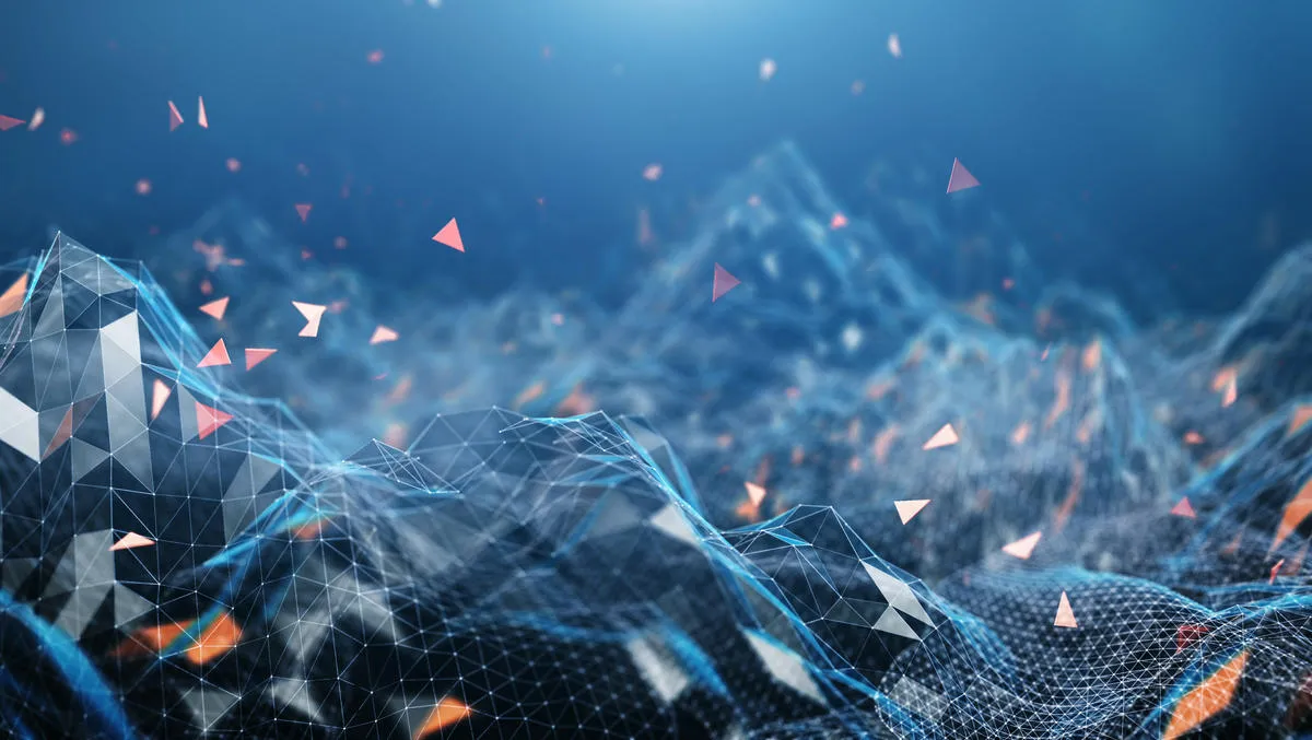 Abstract digital landscape consisting of blue polygonal mesh waves with white and orange glowing triangular particles floating above, set against a blue gradient background.