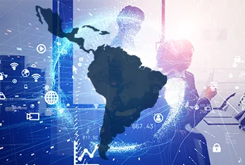Digital composite showing a dark blue silhouette of South America over a blurred background with a person using a laptop and various technology icons representing data, wireless signals, and security.