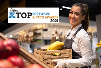 Smiling woman wearing apron and gloves holding a wooden crate with bananas in a grocery store, with a Food Logistics Top Software & Tech Awards 2021 logo overlay.