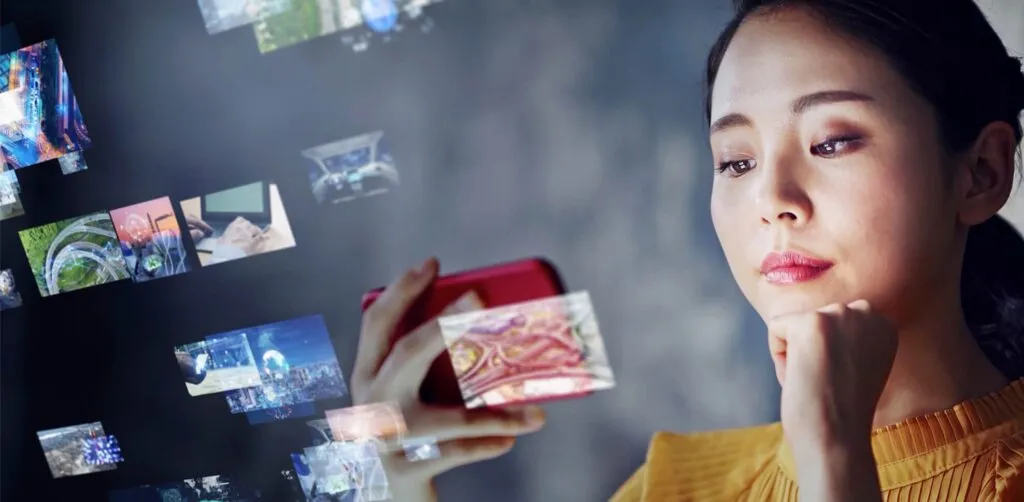 A woman considers multiple content acquisition options across a single mobile device