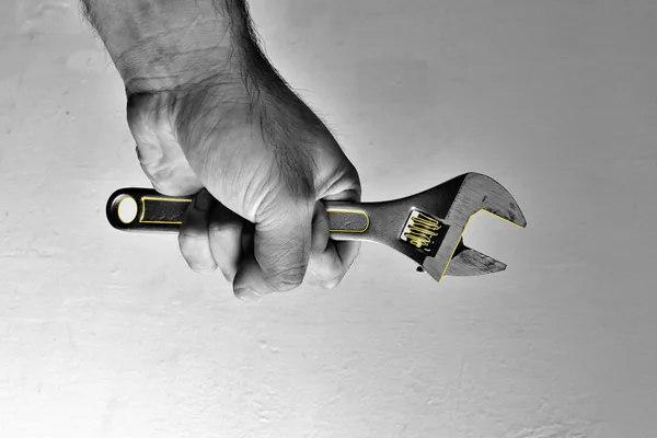 Hand holding wrench - The Culture Architect Program