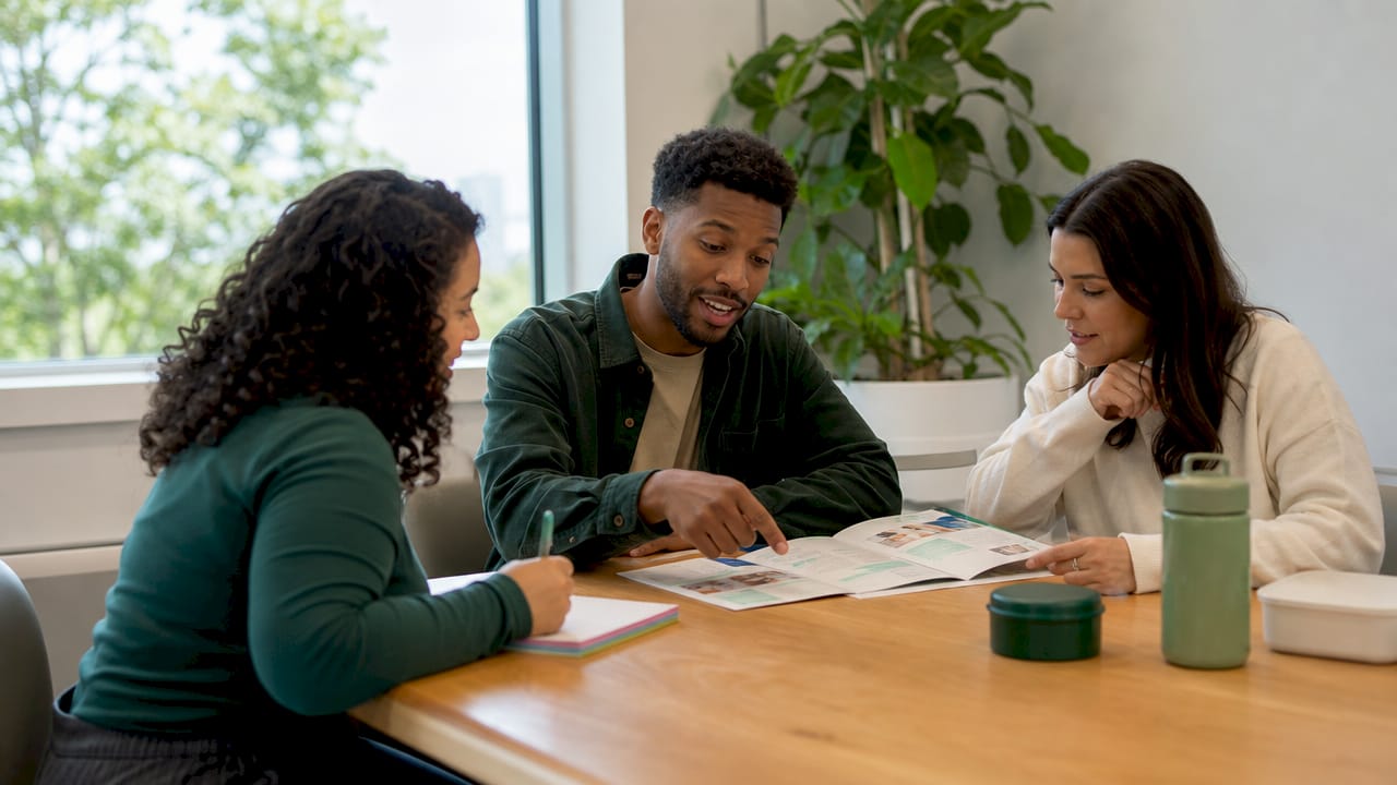 Employees discussing employer insurance plan