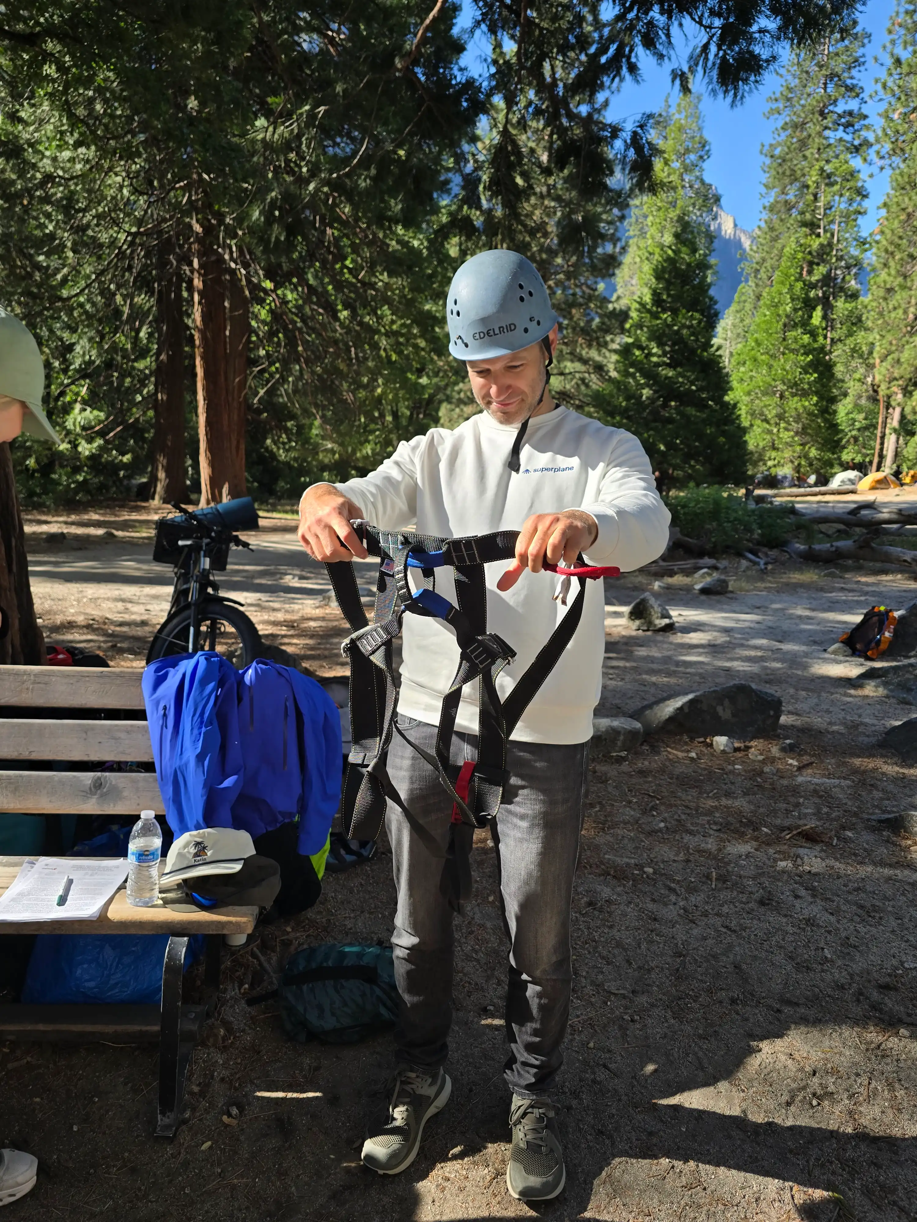 Group members getting fitted with climbing gear