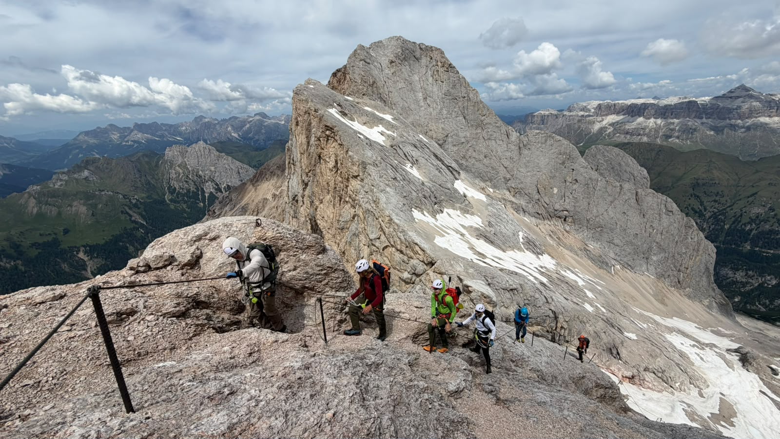 The group on the cables of the West Ridge via ferrata section on Marmolada