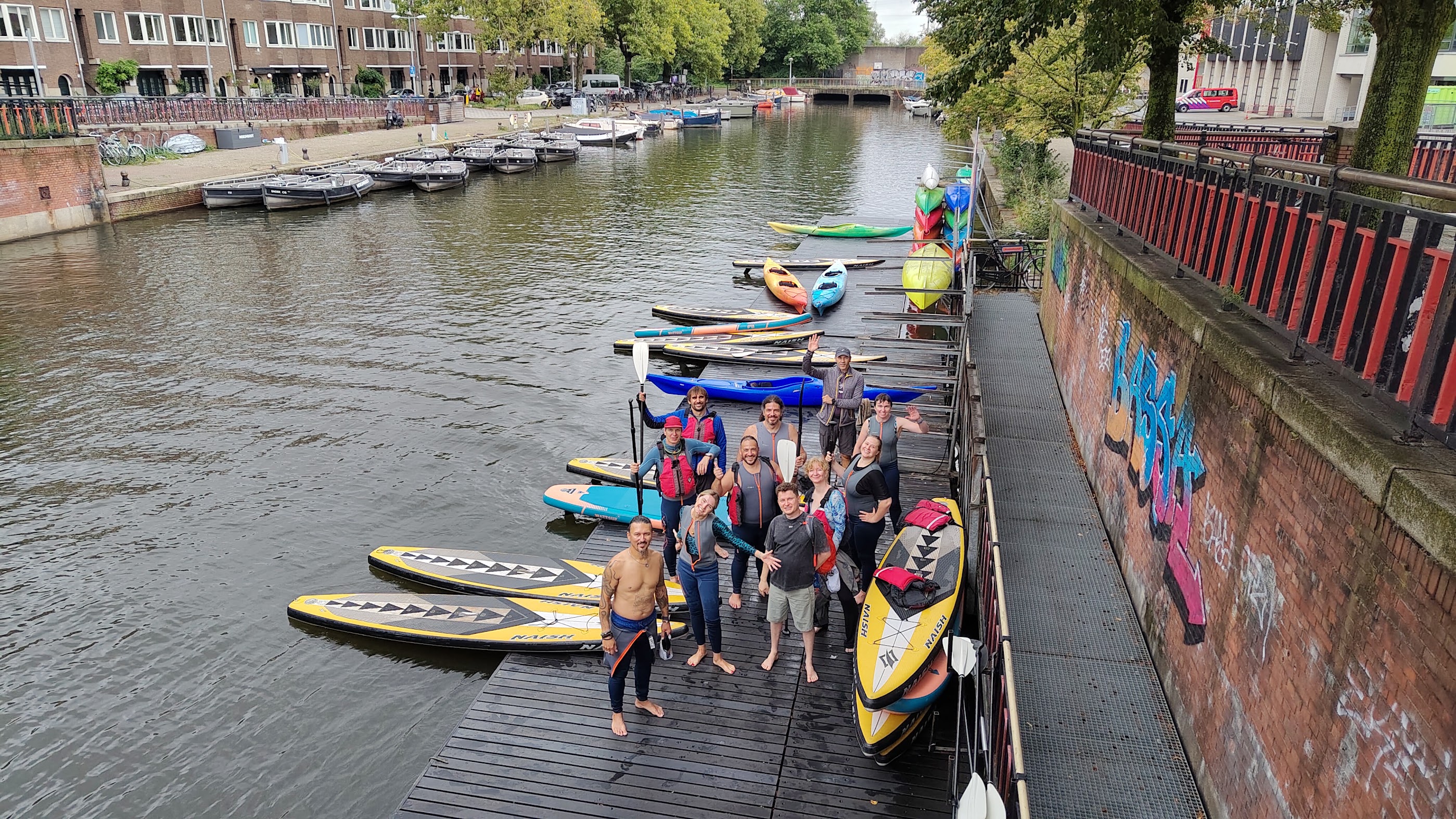 Overhead view of the group and their paddleboards back on the dock after the paddle