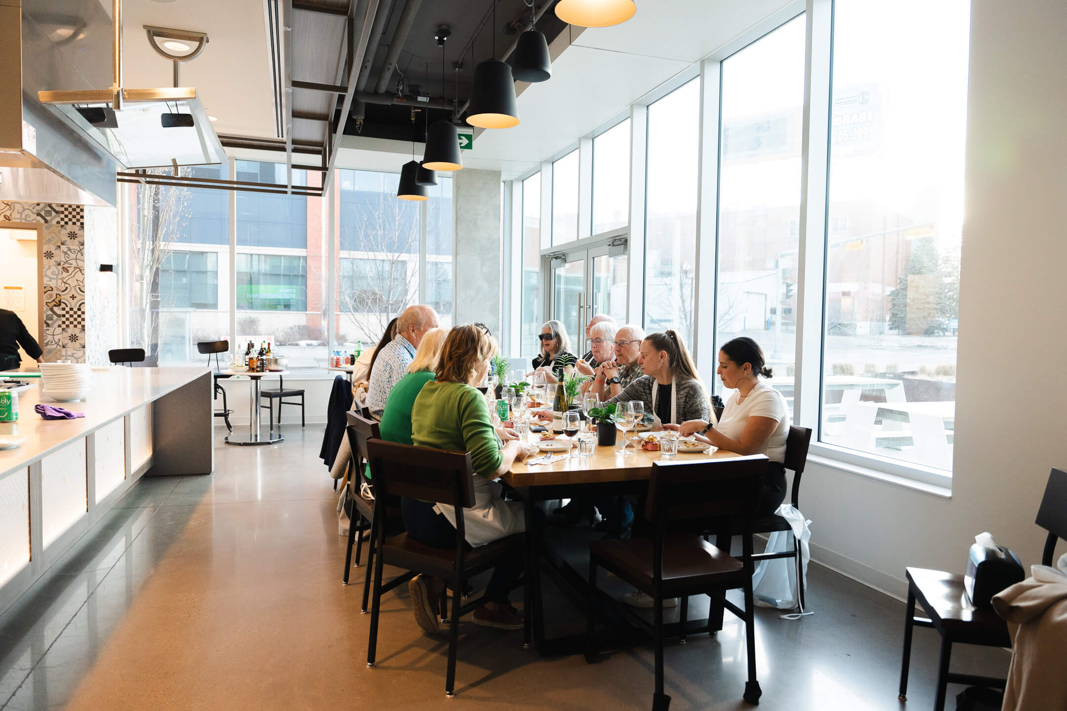 Group dining together after a Chef Joey corporate cooking class in Calgary