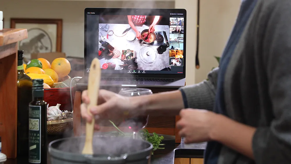 Virtual cooking class participant on Zoom with Chef Joey from their home kitchen