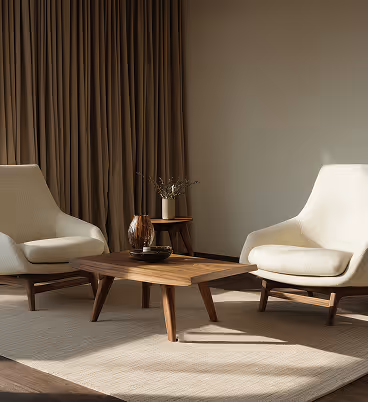 A cozy room with two chairs and a small table, complemented by a large curtain in soft beige and brown tones, highlighting refined interior design and elegant architectural styling.