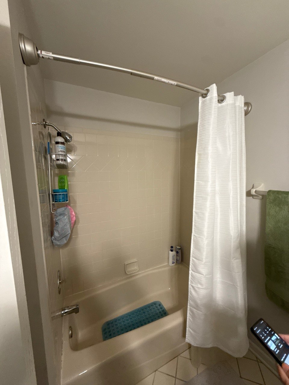 Before photo of bathroom remodel in Naperville, IL showing old bathtub shower combo, outdated tile surround, and original bathroom layout