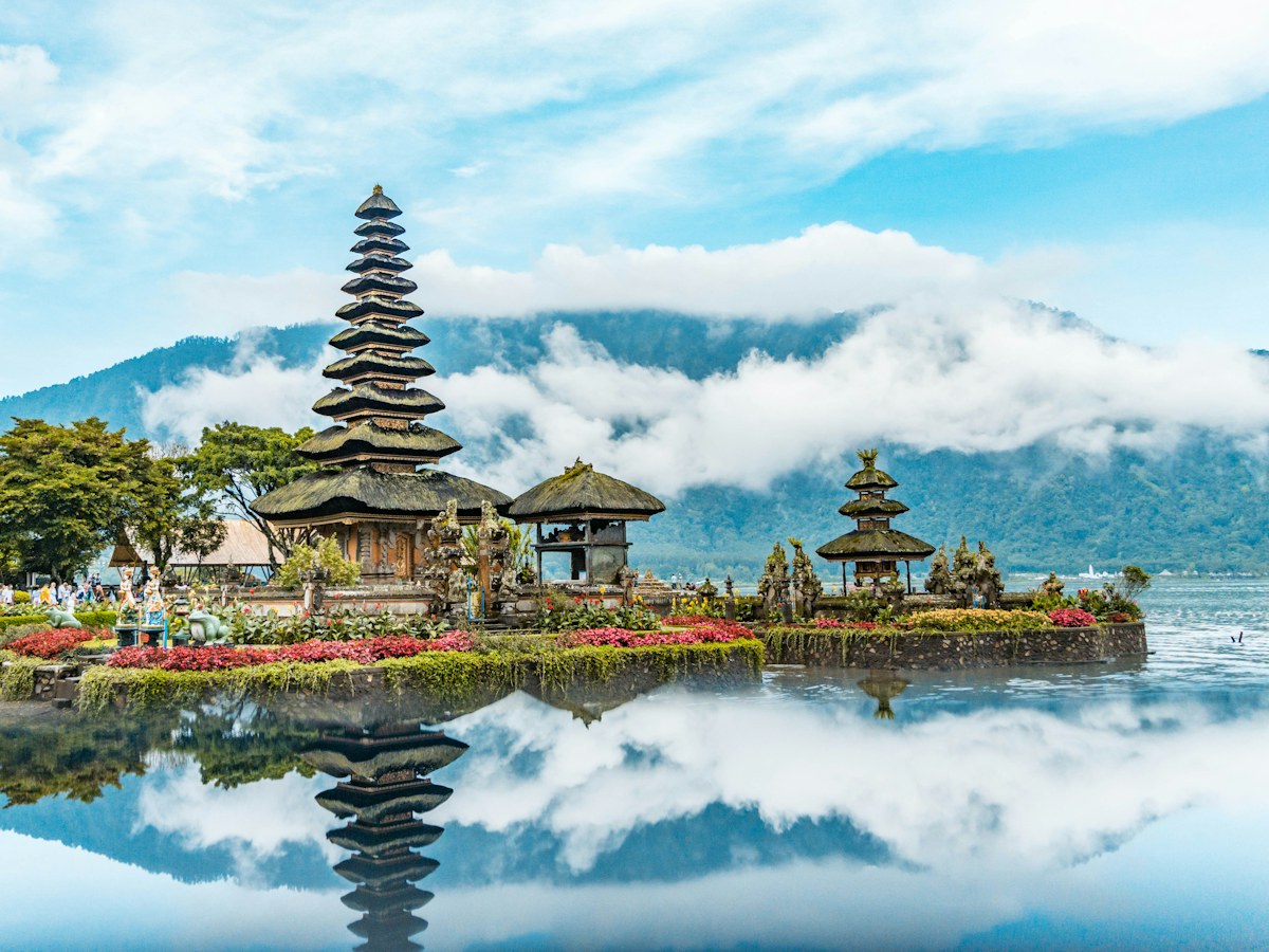 Pura Ulun Danu Beratan water temple on Lake Beratan, Bali, with cloud over the mountains