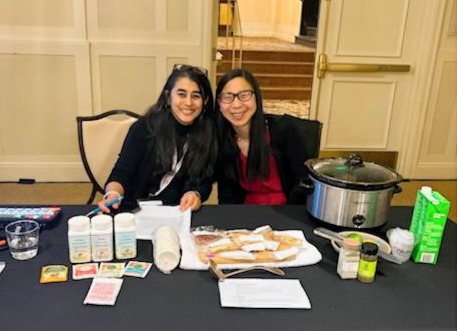 Dr. Michelle Loy giving a culinary medicine cooking demonstration at a hotel conference