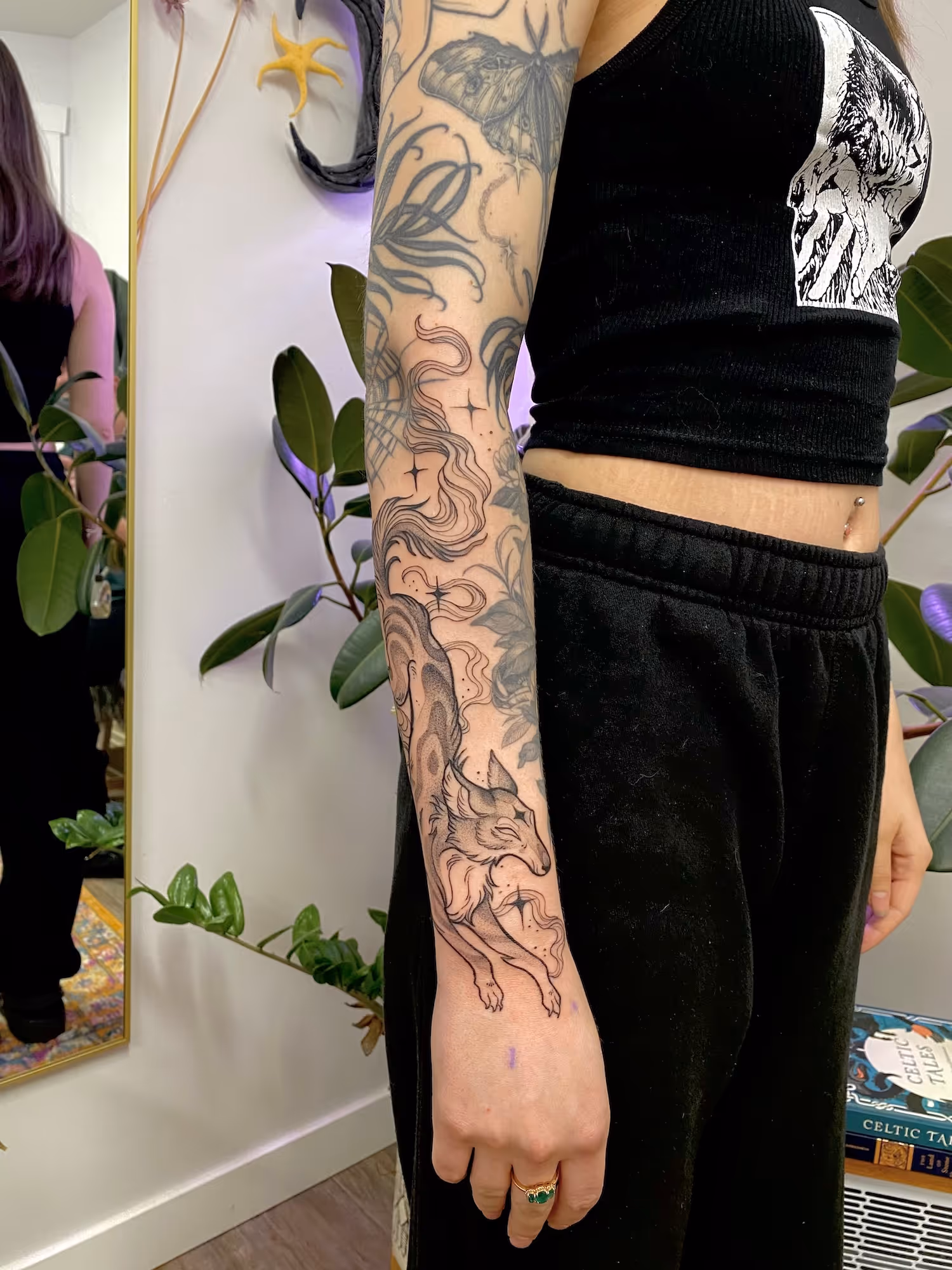 Blackwork forearm tattoo of a stylized fox in flowing smoke and stars, by Alyssa at Vale of the Fae in Castlegar, BC