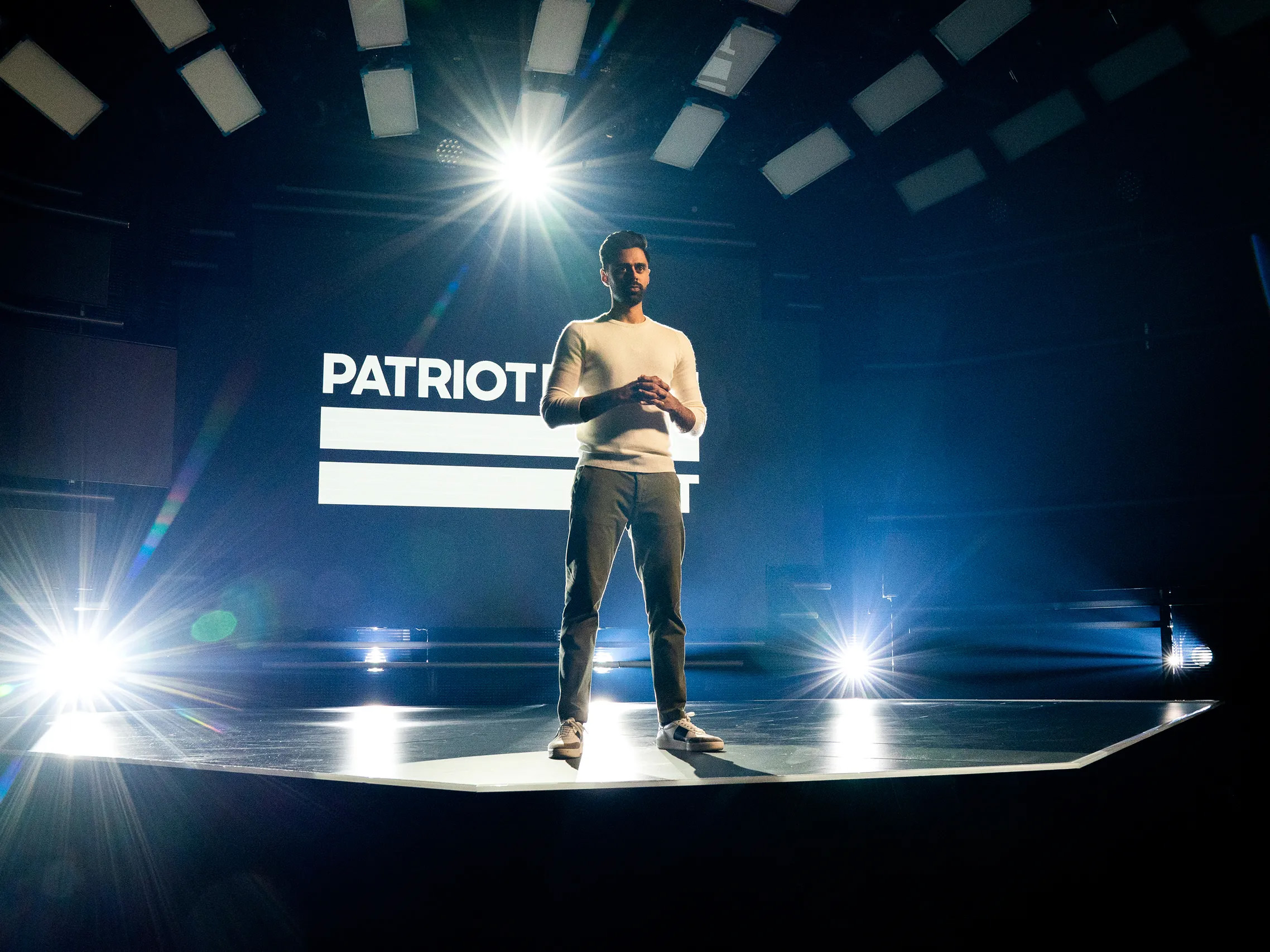 Patriot Act with Hasan Minhaj set, wraparound LED wall lit behind the host podium
