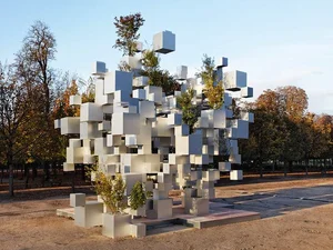 Pavilion built from stacked white cubes and planting in an autumn park