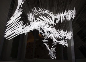 White light rods radiating outward in a dark interior