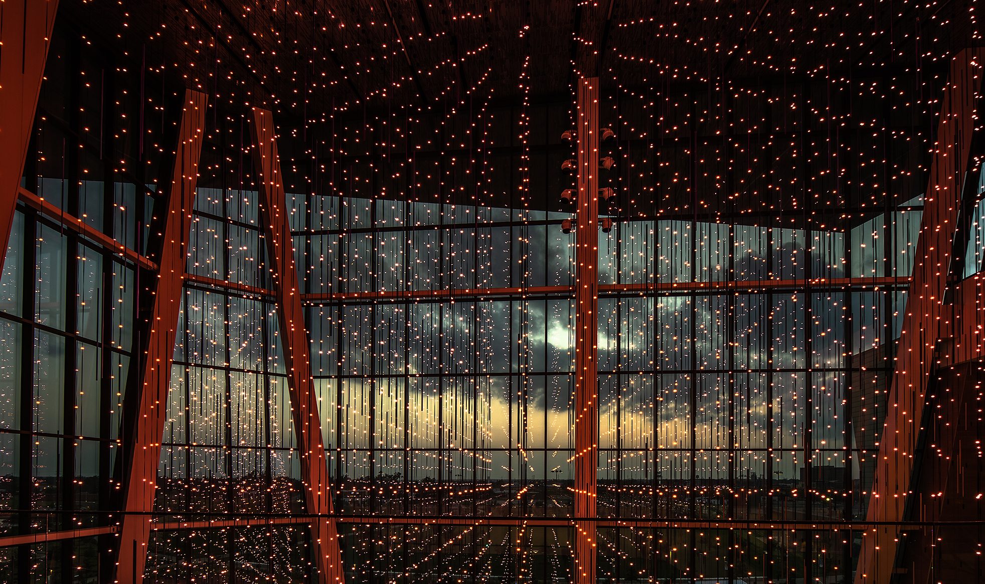 Virtual Sky LED strands against the atrium glazing at sunset