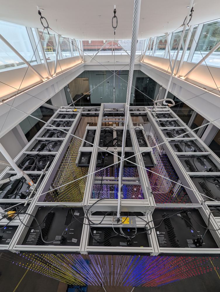 Overhead view of the Hypercube rigging grid and cabling above the atrium