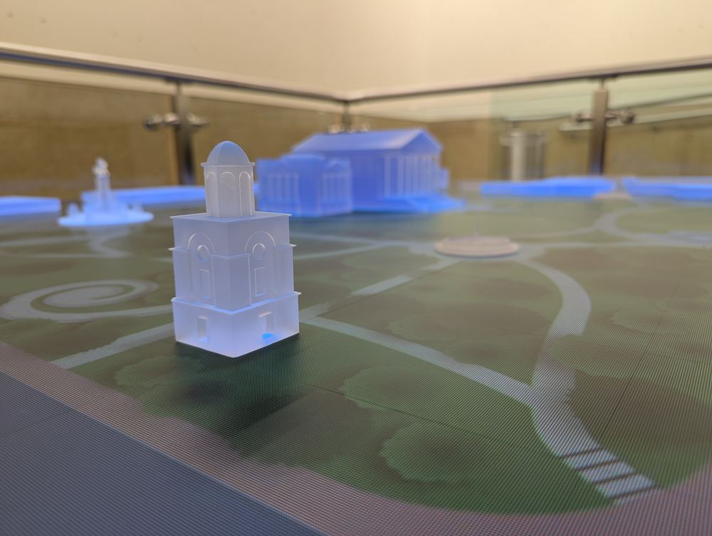 Detail of a translucent acrylic building model on the illuminated Capitol table map