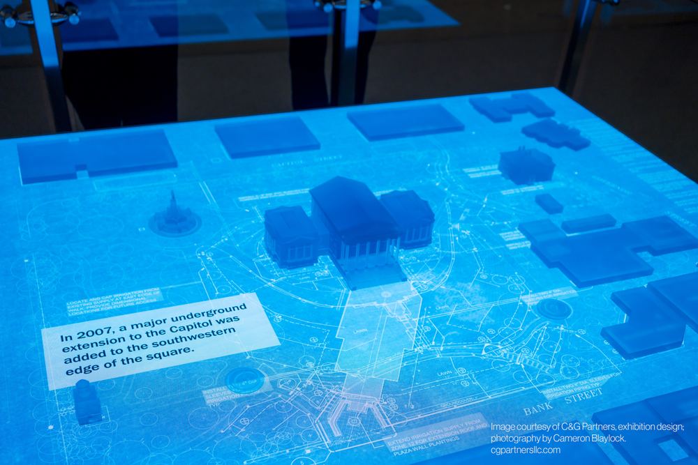 Close-up of the Virginia Capitol LED table surface with building models and caption text