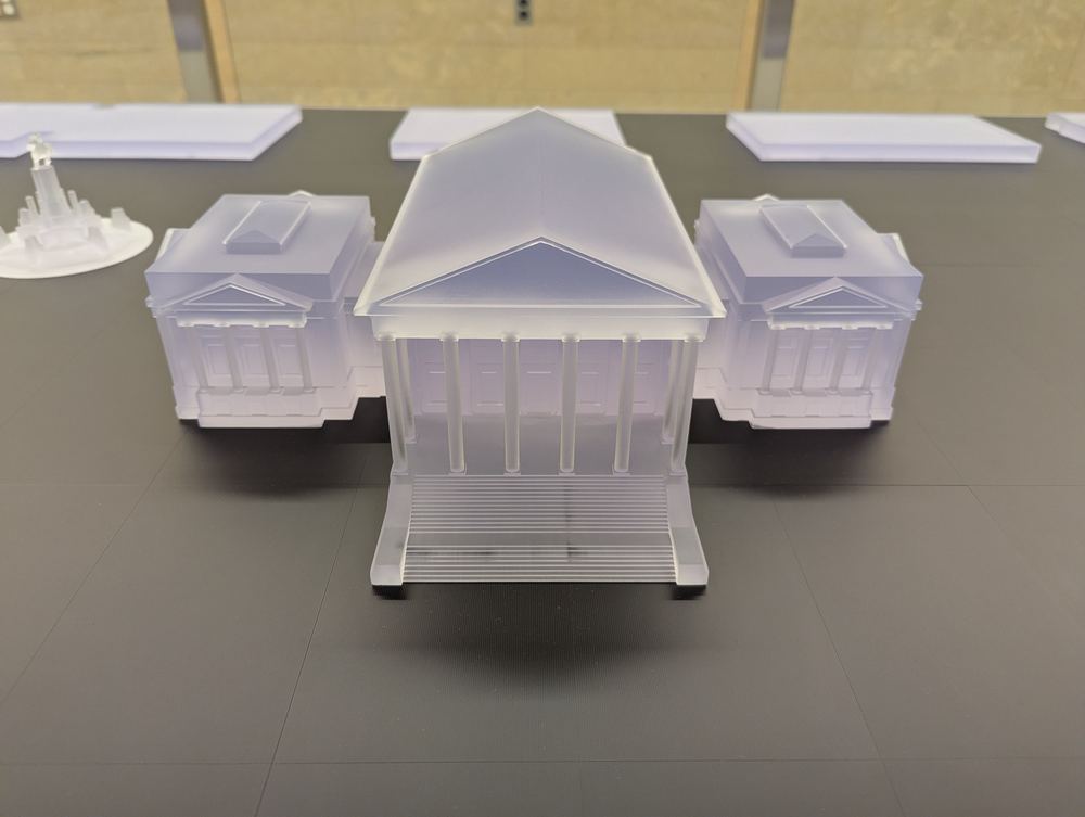Close-up of the acrylic Capitol building model at the centre of the table