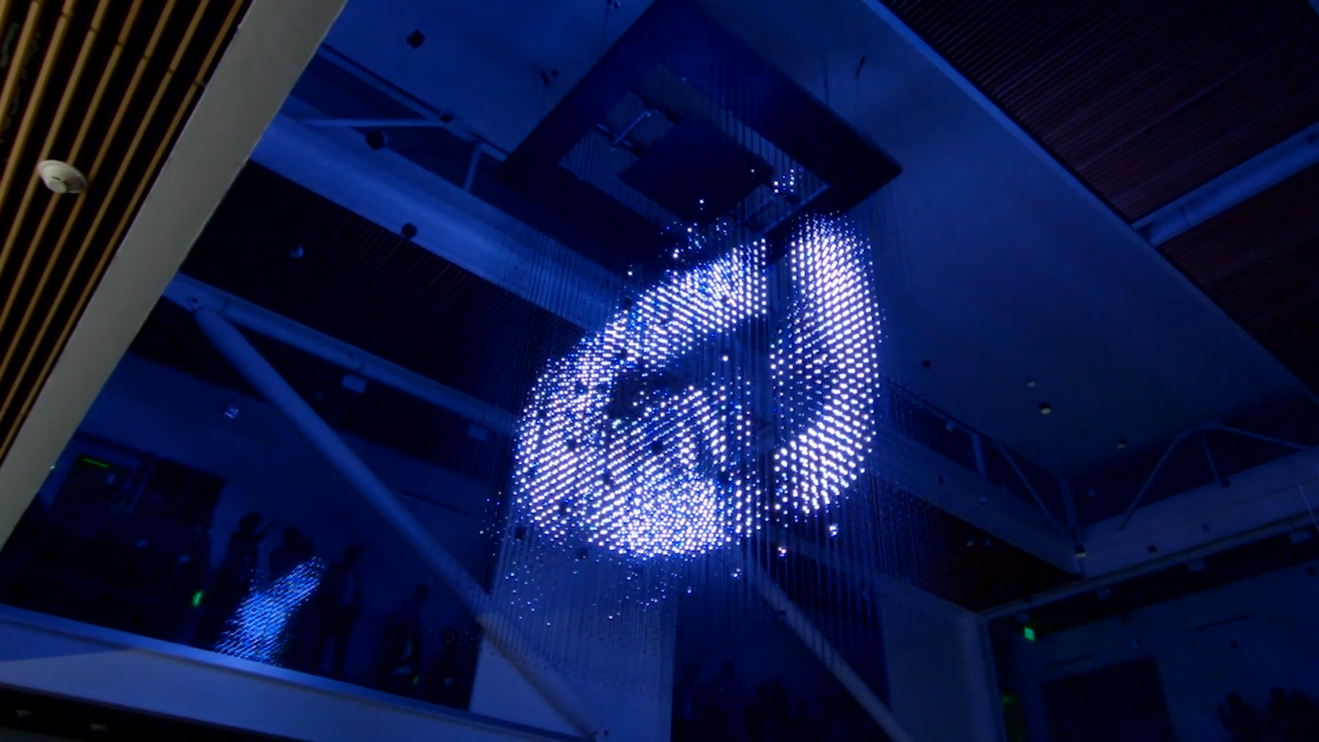 Circular graphic rendered in blue across the face of the Strauch Hypercube