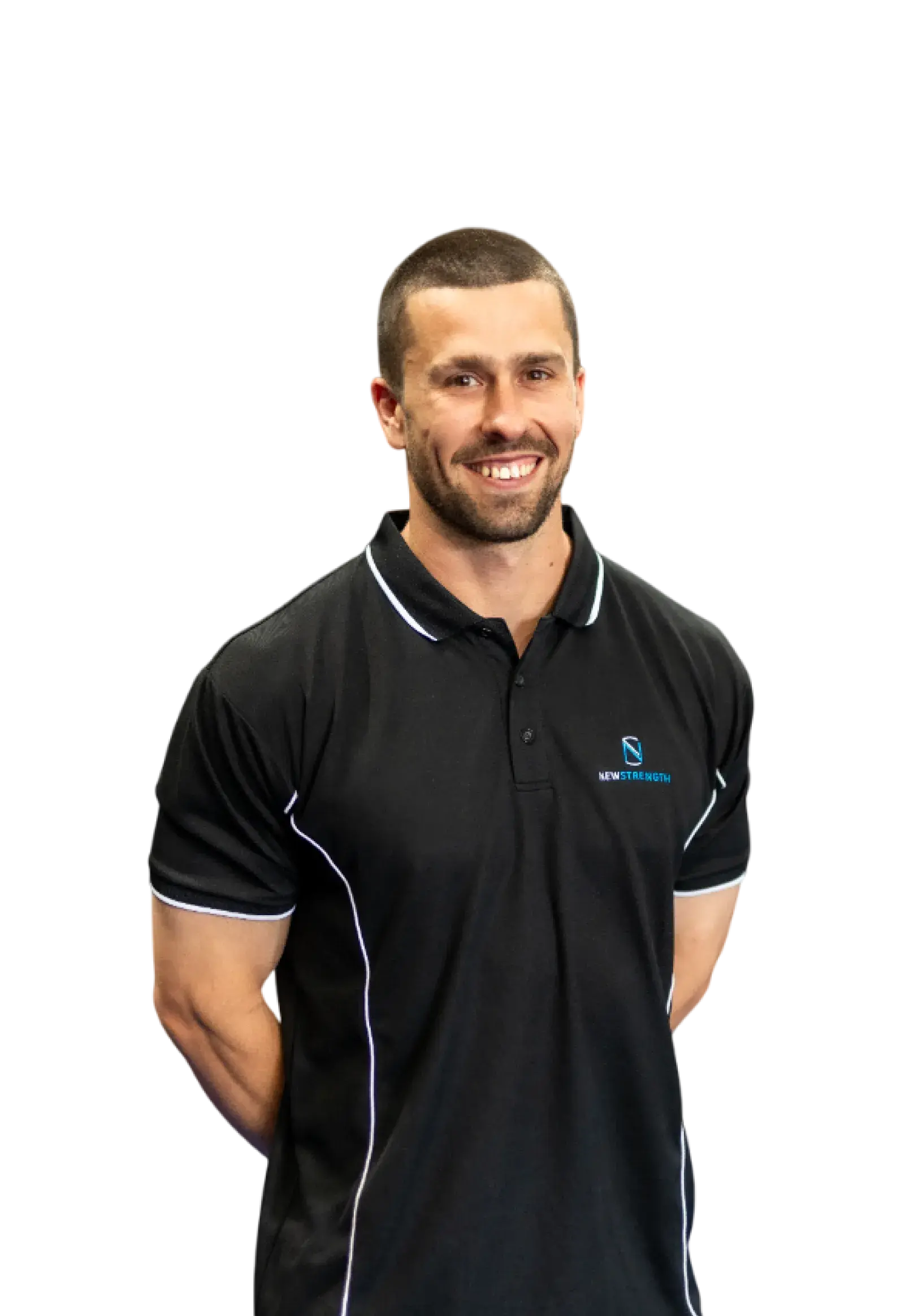 Smiling man with short hair wearing a black polo shirt with white piping and a New Strength logo.