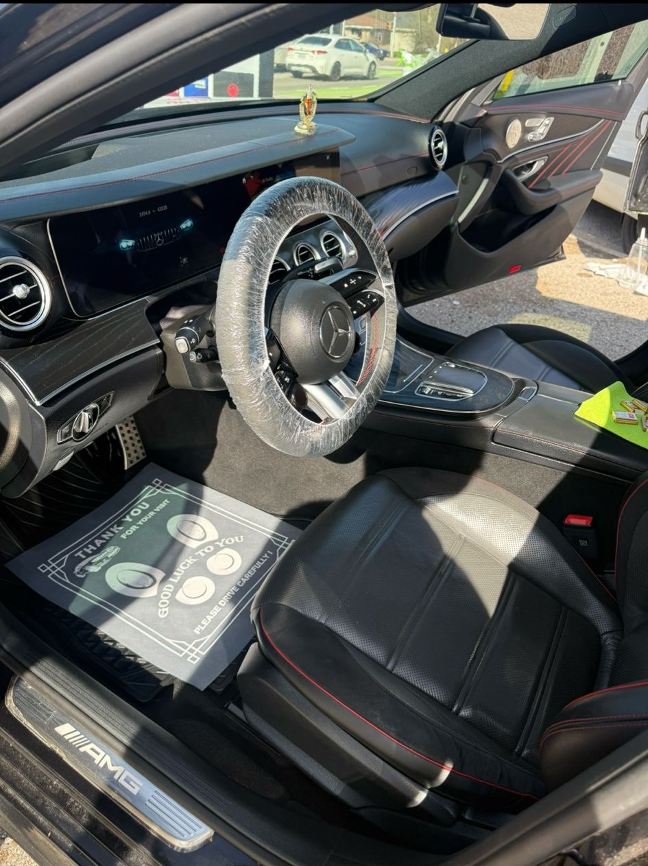 Black car seat with red stitching, featuring the text 'We got you covered' with a diamond emoji.
