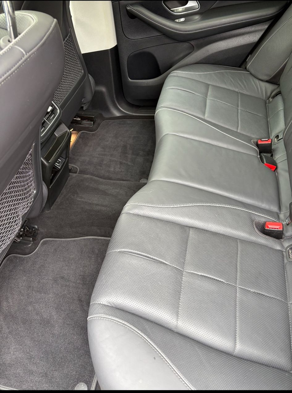 Black car seat with red stitching, featuring the text 'We got you covered' with a diamond emoji.