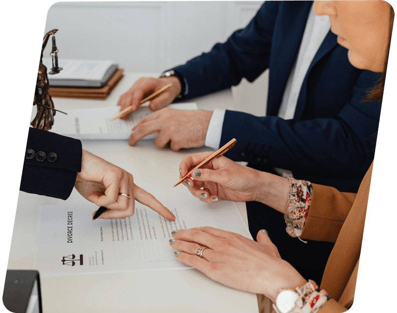 Clients reviewing legal documents during a family law consultation, supported by Converxion Lab’s client-focused growth approach