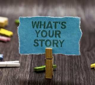 A beaver drinking water from a pond in a forest with a woman crouching nearby and a metal animal trap cage beside her.