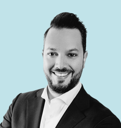 Black and white portrait of Oliver R. Baumann, founder and CEO of Xlife Sciences, on light blue background