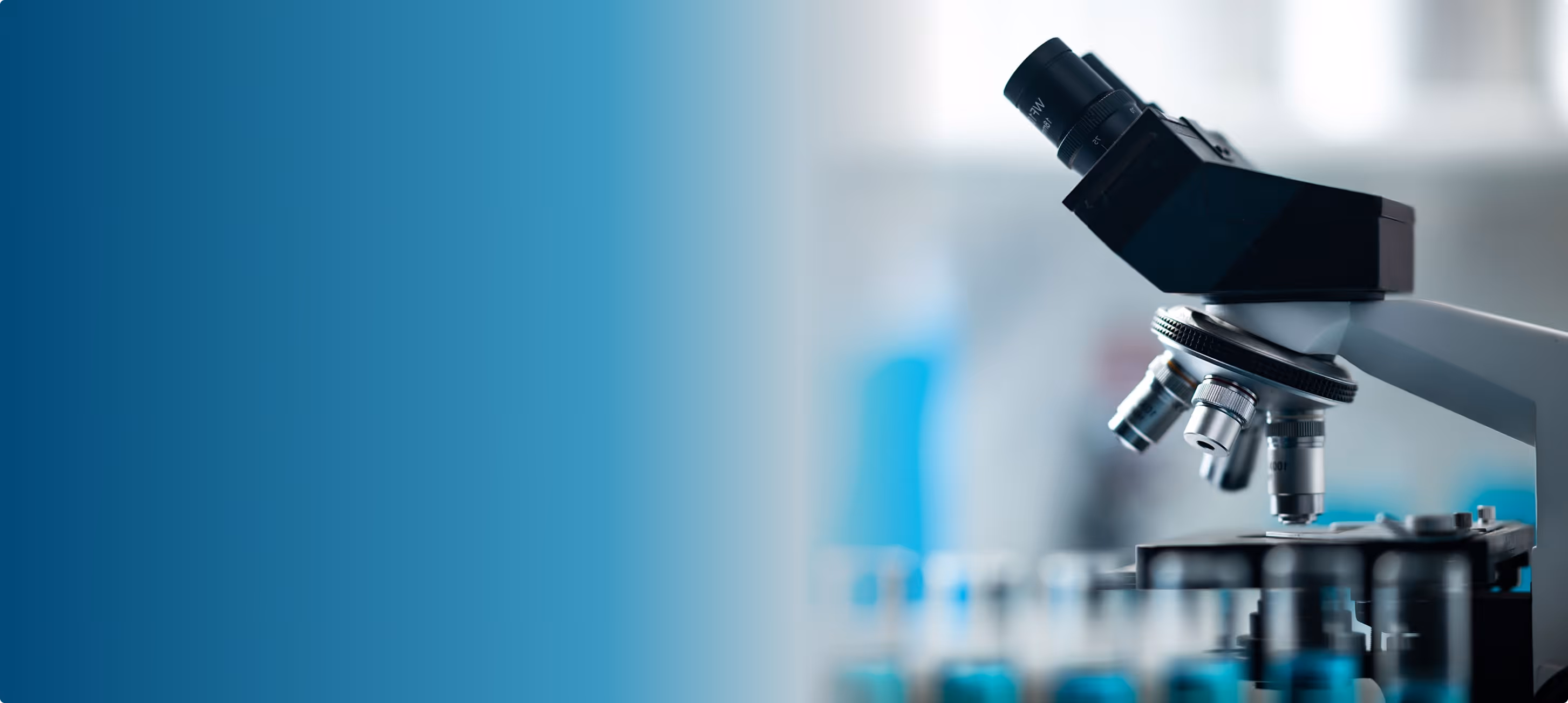 Laboratory microscope head and turret in soft focus beside a teal gradient background panel