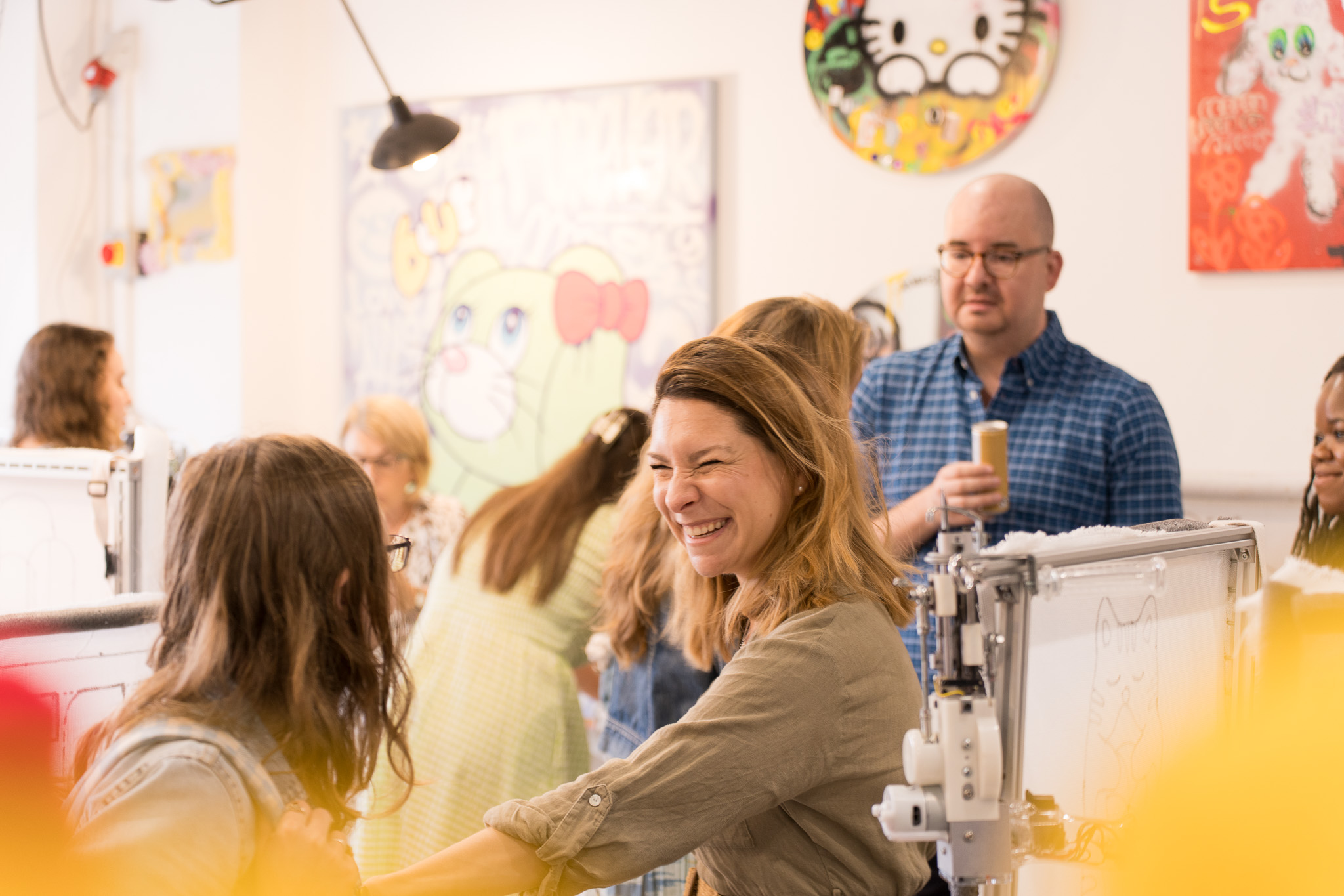 People enjoying a beginner-friendly rug tufting workshop at Cheeky Studio in Hackney Wick, London