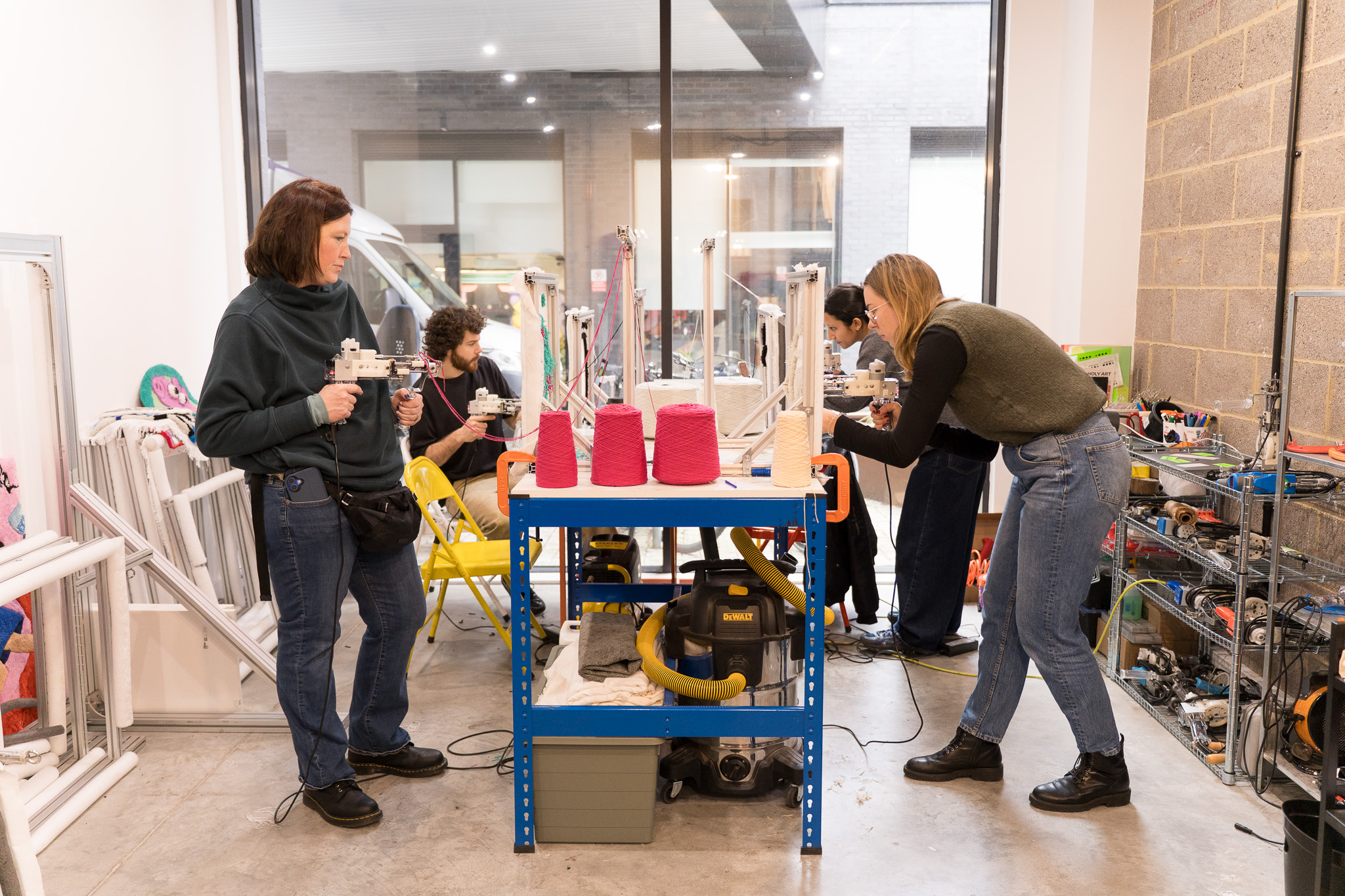 Small group of students tufting rugs simultaneously at Cheeky Studio beginner workshop, Hackney Wick East London