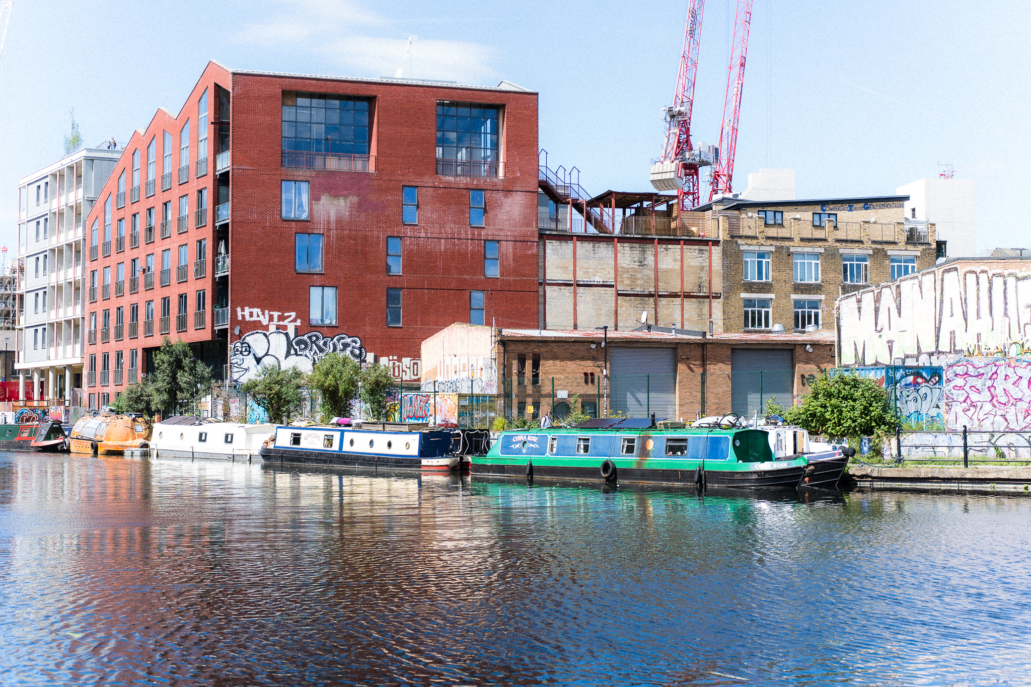 River Lea canal with narrowboats and industrial buildings in Hackney Wick, East London — near Cheeky Studio tufting workshop