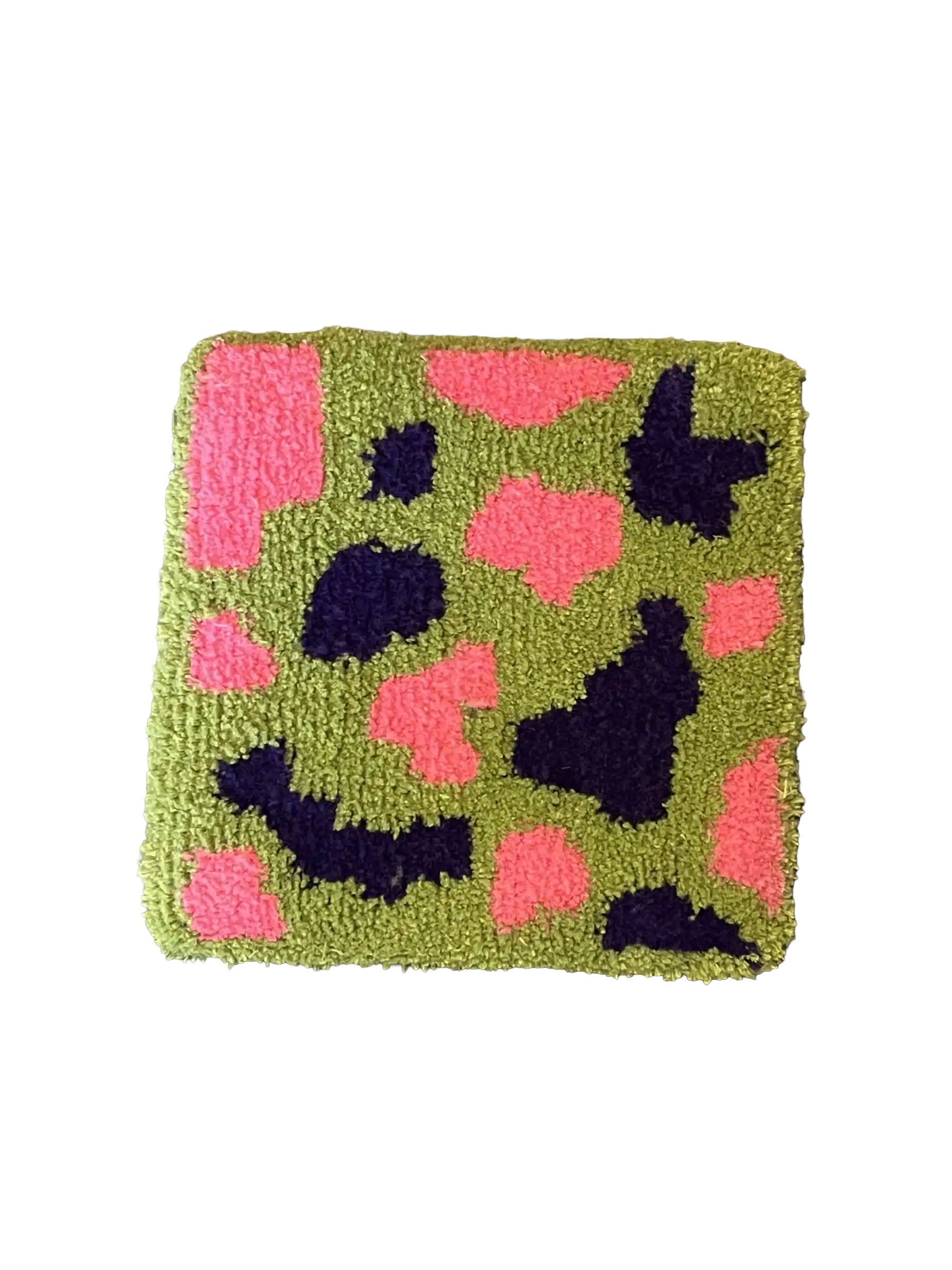 Abstract cow print style rug in green with pink and navy patches