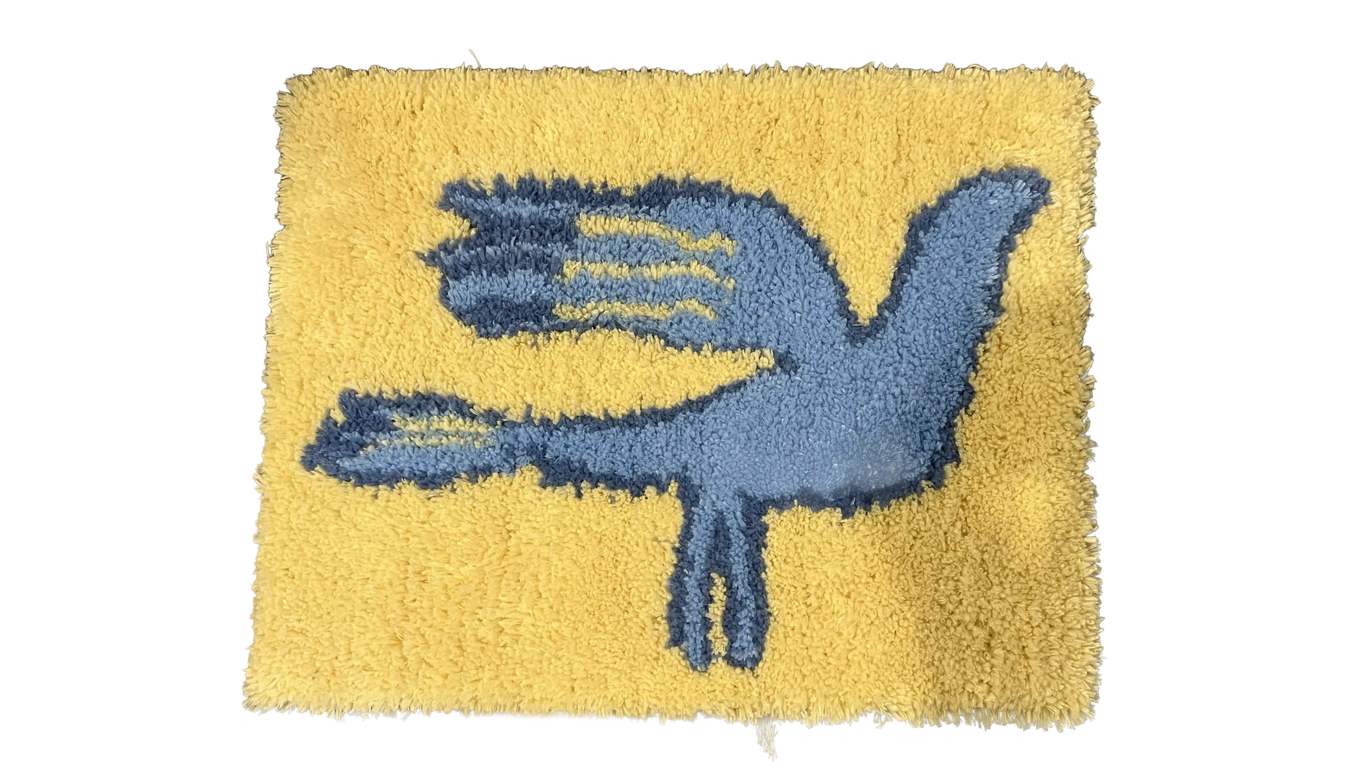 Blue bird rug with wings spread, tufted on a yellow background