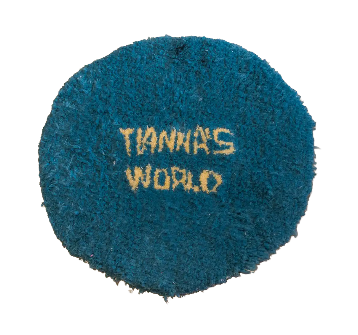 Round teal customer-made tufted rug with cream “Tianhang World” lettering