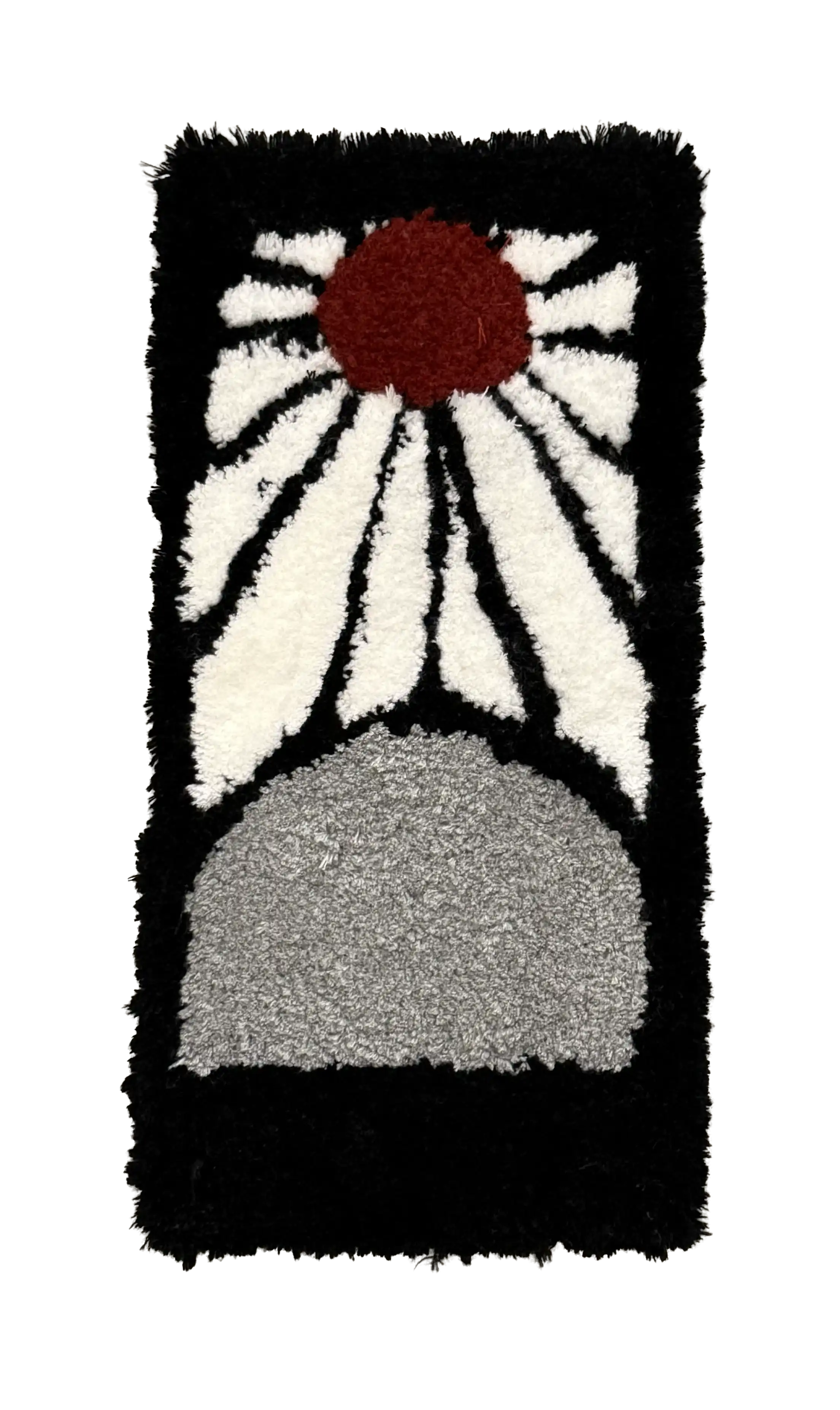 Black rectangular tufted rug with a red sun, white rays and a grey semicircle
