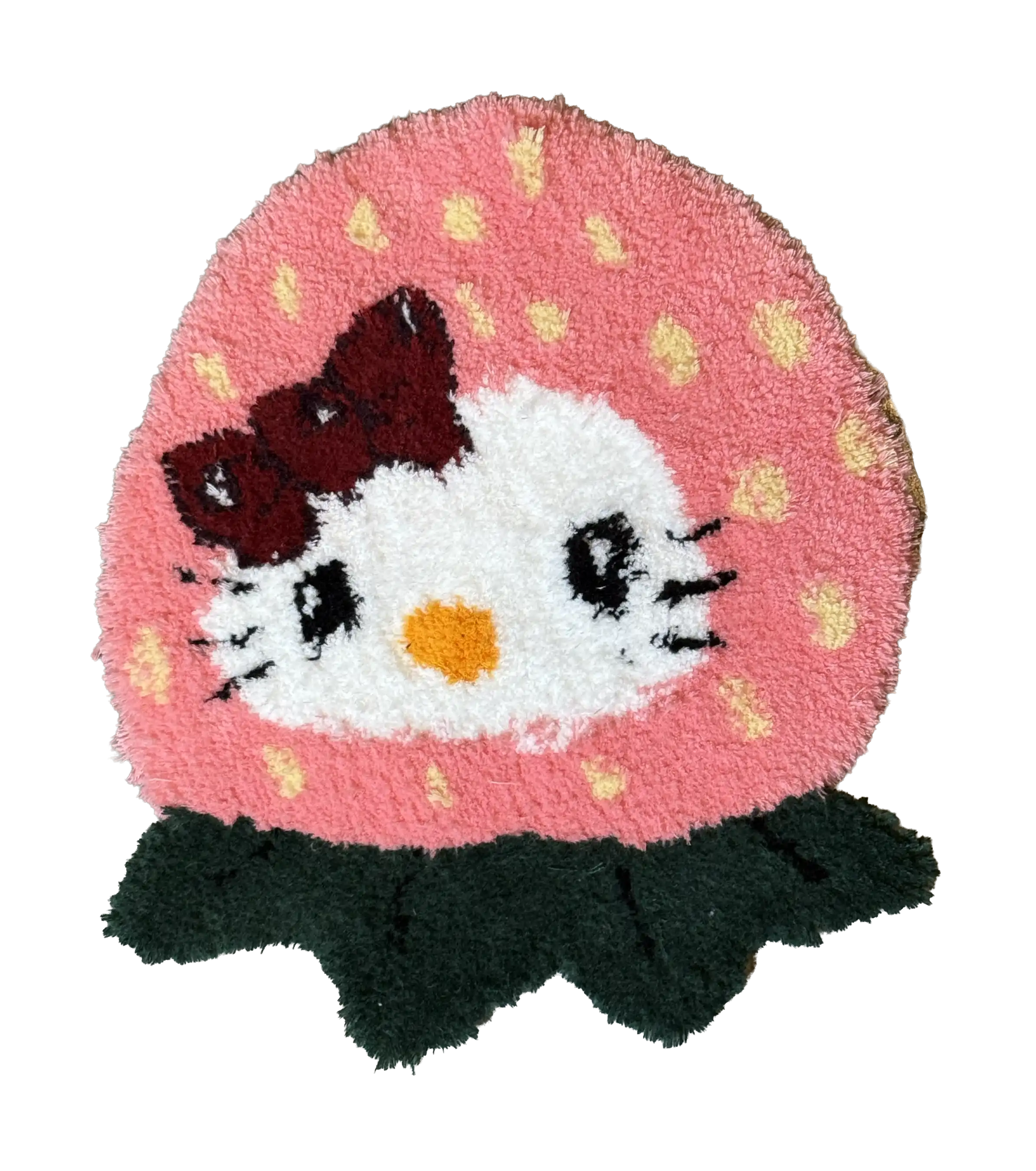 Strawberry-shaped tufted rug with a white cartoon cat face, red bow and dark green leaves
