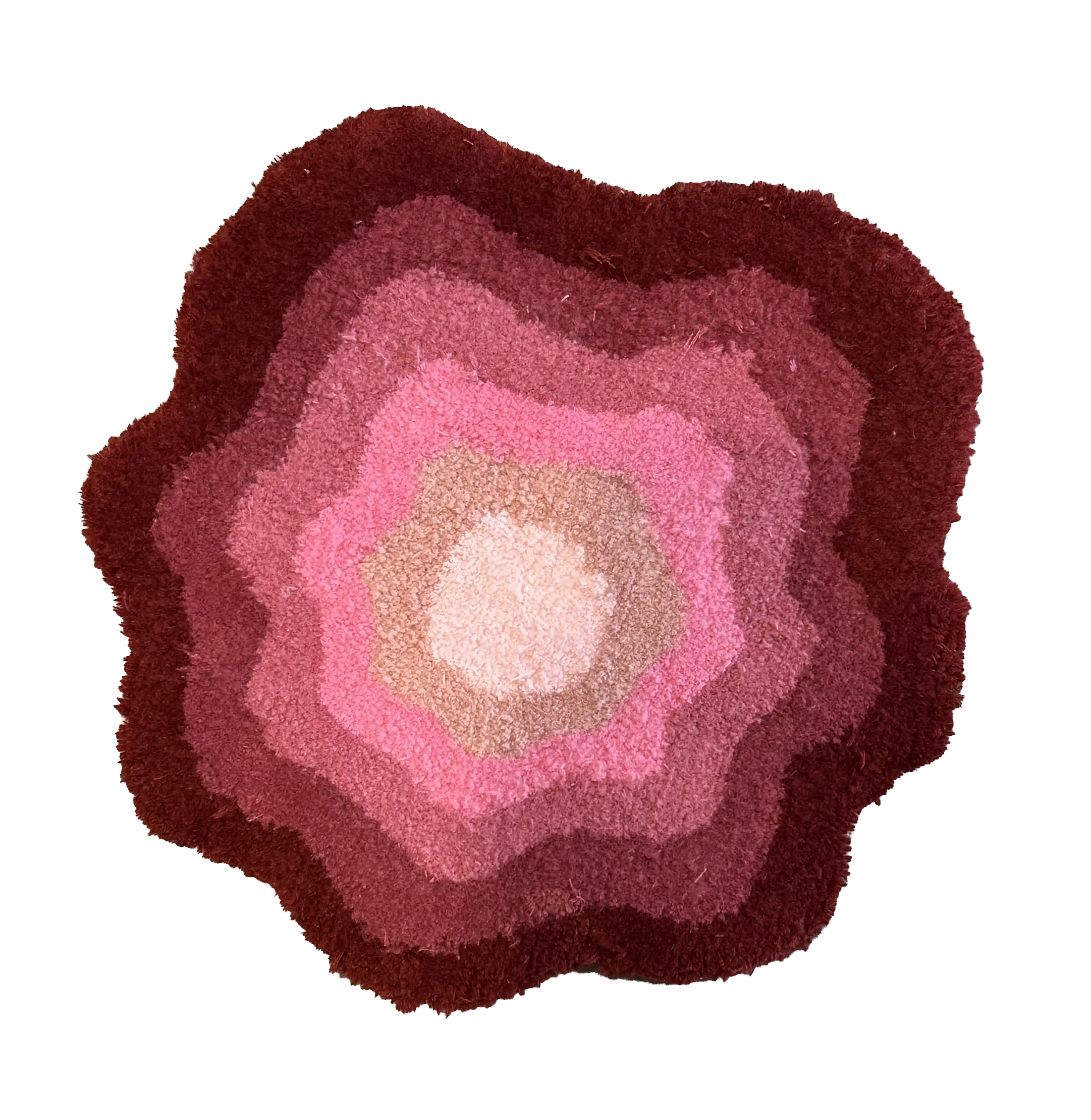 Flower-shaped tufted rug with concentric layers of burgundy, pink and cream