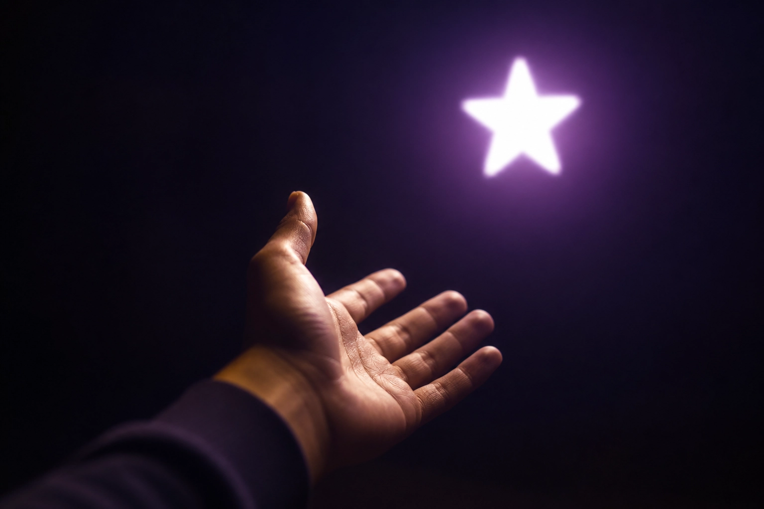 A hand reaching toward a glowing star, symbolizing the hope and connection that authentic storytelling brings to non-profit missions
