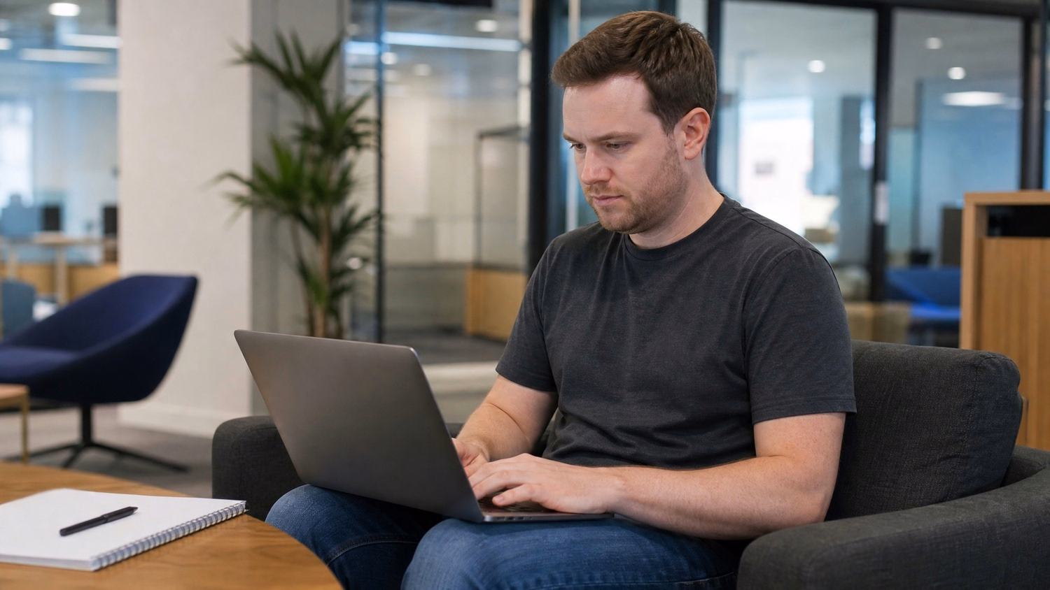 LOUNGE AREA LAPTOP An IT professional  one person working on a laptop in a ca