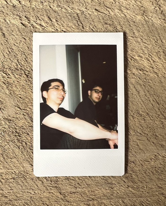 Polaroid of two Runpod teammates
