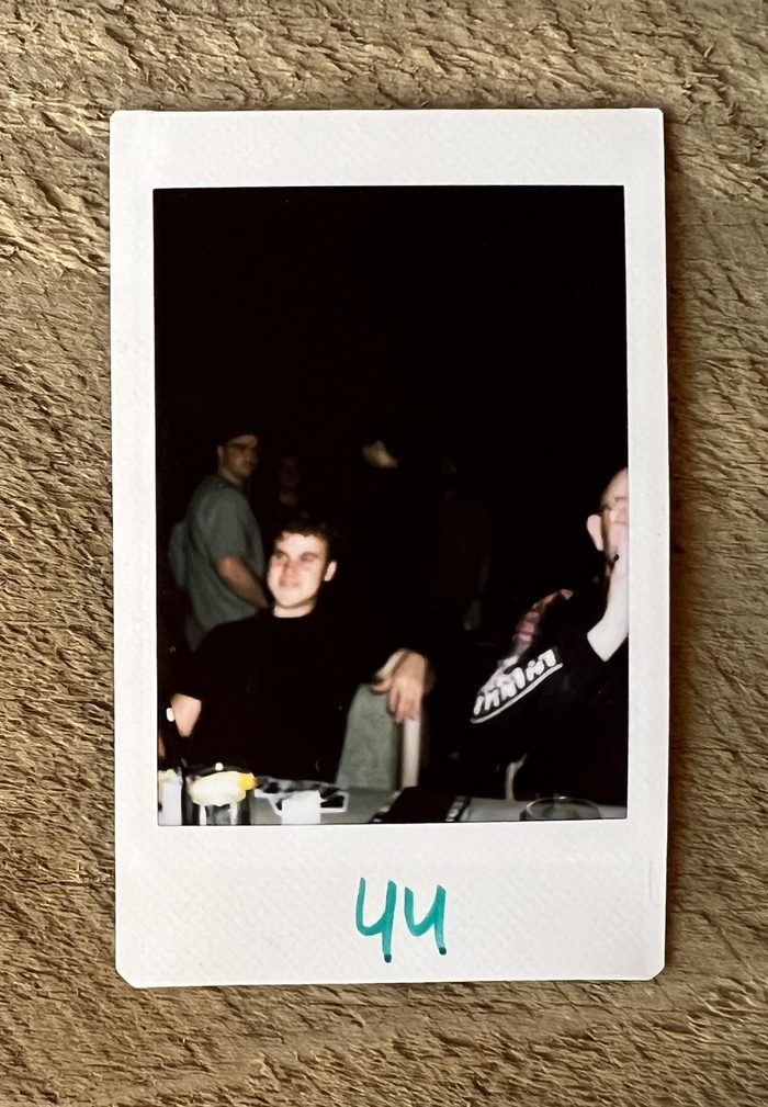 Polaroid of the Runpod team at a late-night meetup