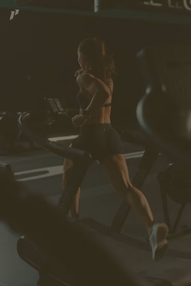 Woman training in a dimly lit gym