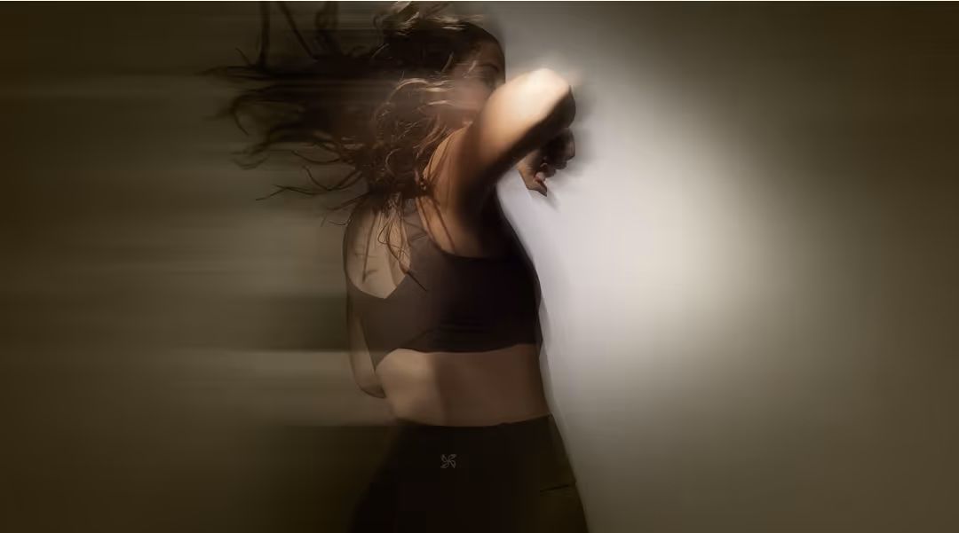 Woman training in motion, hair flying