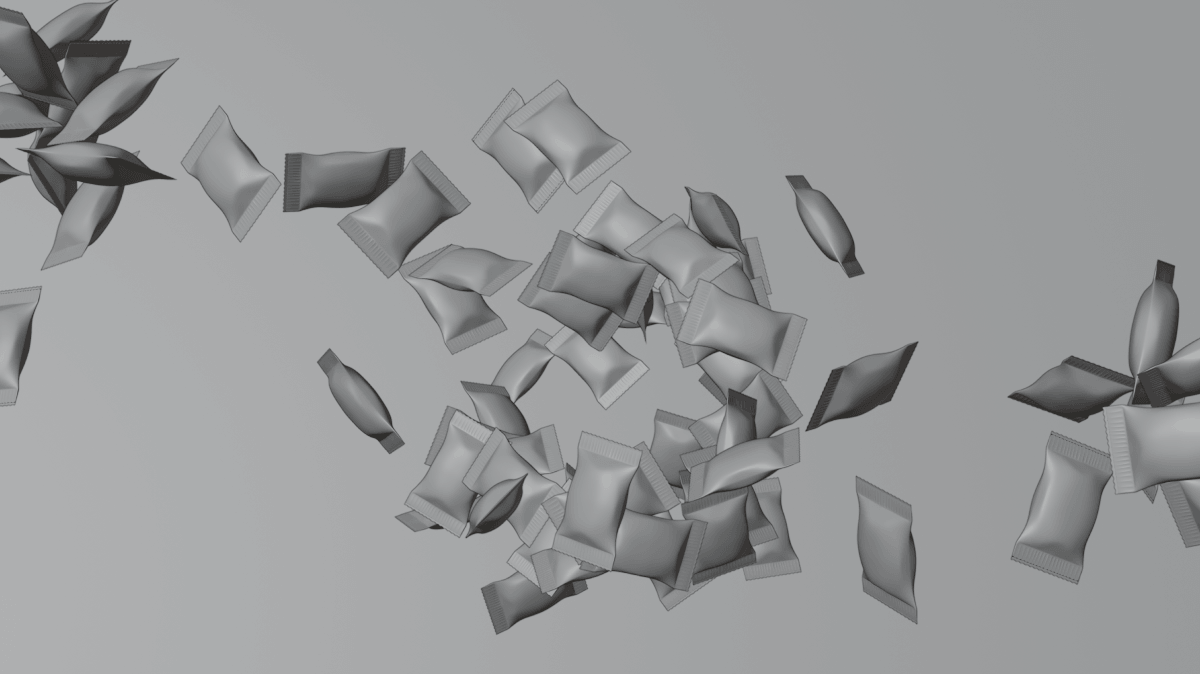 Multiple small, rectangular and pillow-shaped packets scattered on a neutral gray surface.