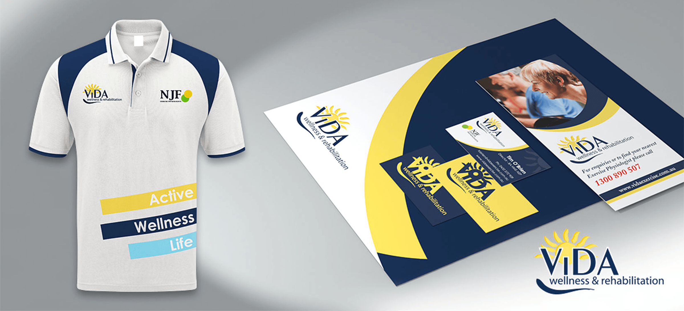 White polo shirt with navy and blue accents featuring VIDA Wellness & Rehabilitation and NJF logos, alongside branded business cards and a brochure.